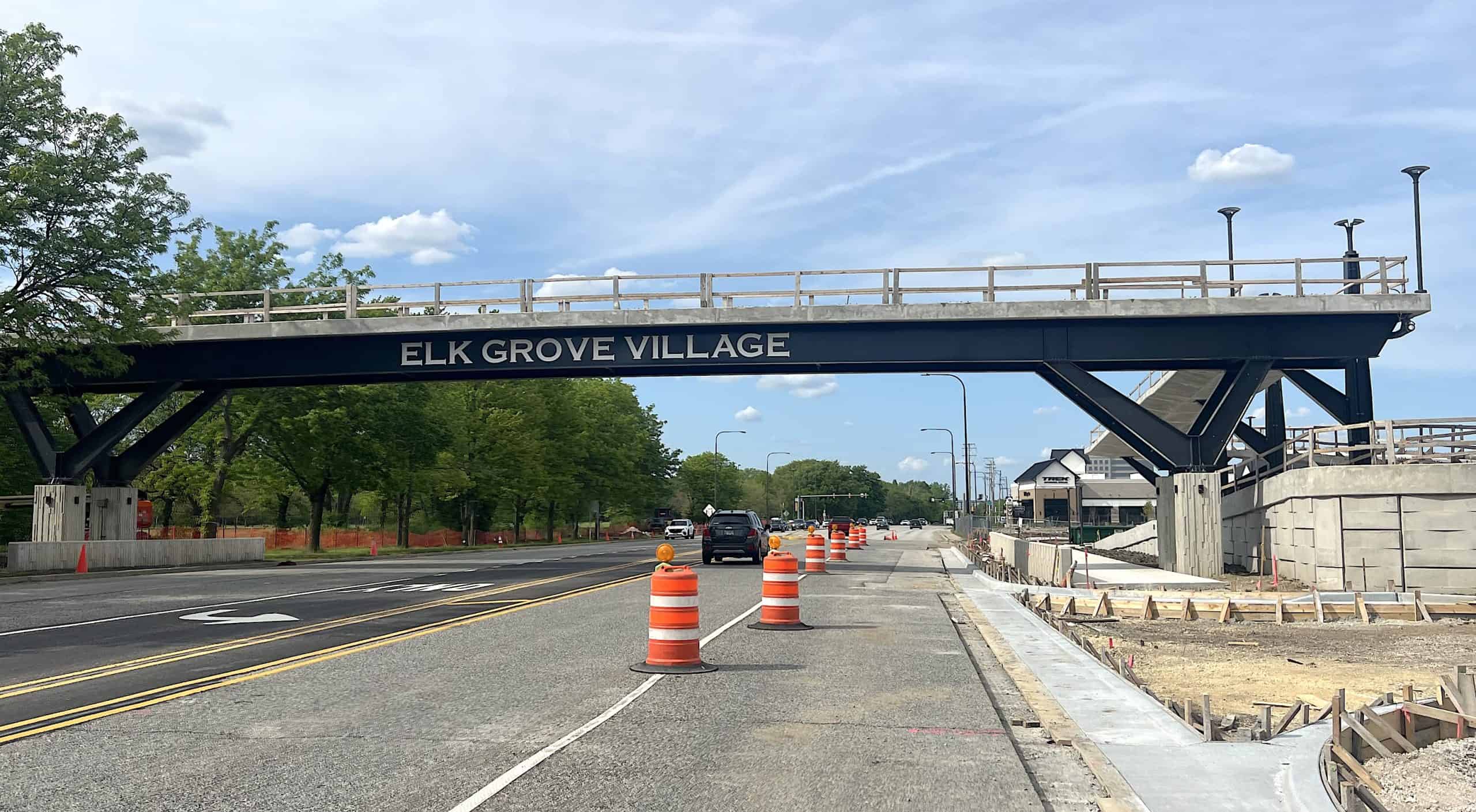 ELK GROVE VILLAGE bridge over road with traffic cones and trees in suburban Chicago.